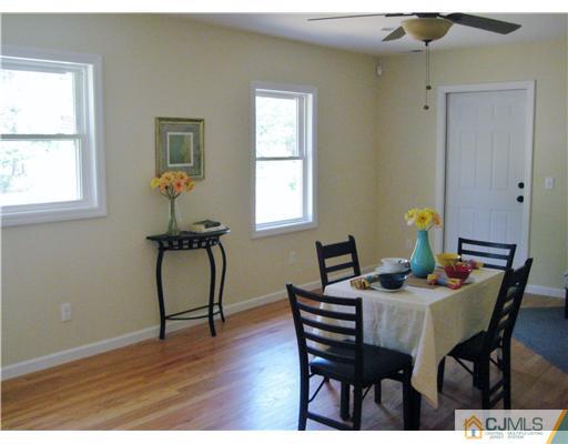211 Lambertson Road Old Bridge, NJ 07747 - Photo 8 of 19 a view of a dining room with furniture and wooden floor
