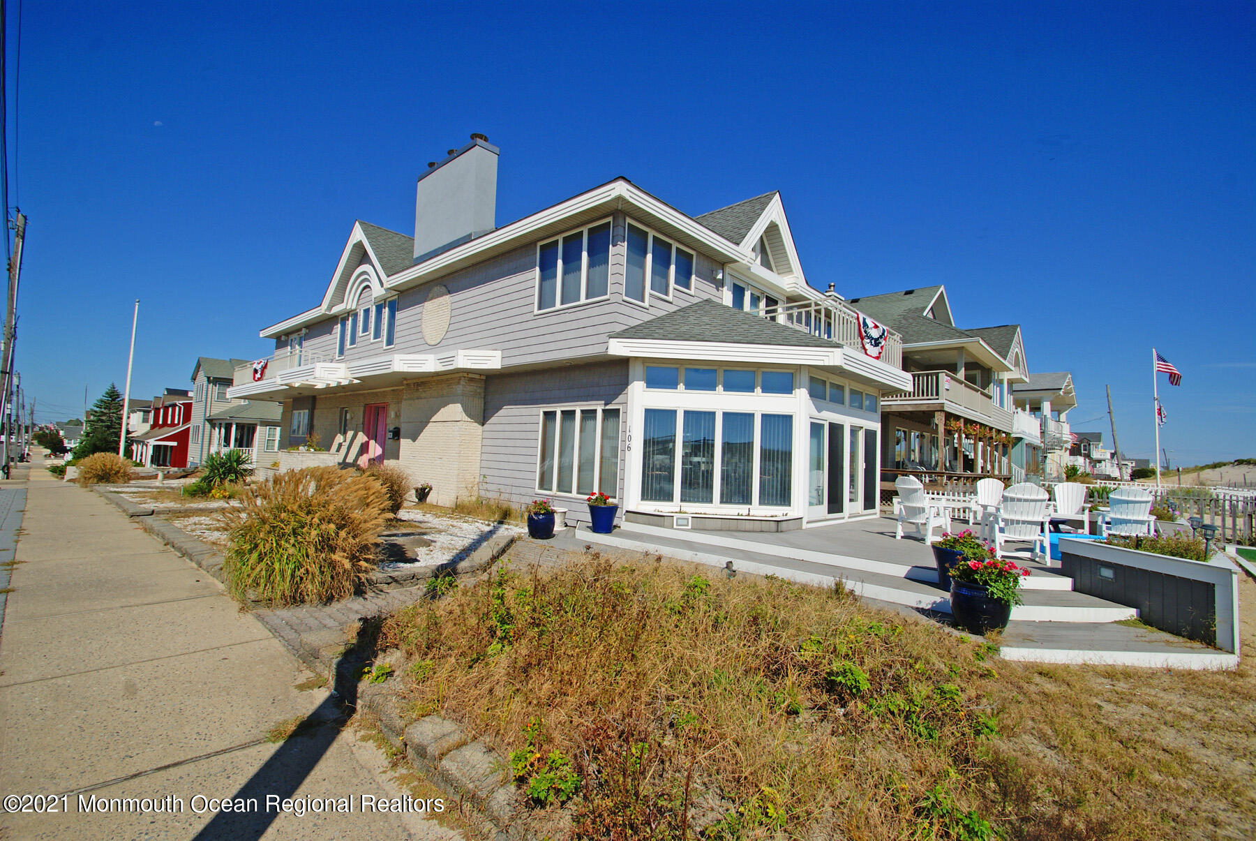 106 Oceanfront Lavallette, NJ 08735 - Photo 1 of 20 a front view of a house with a yard