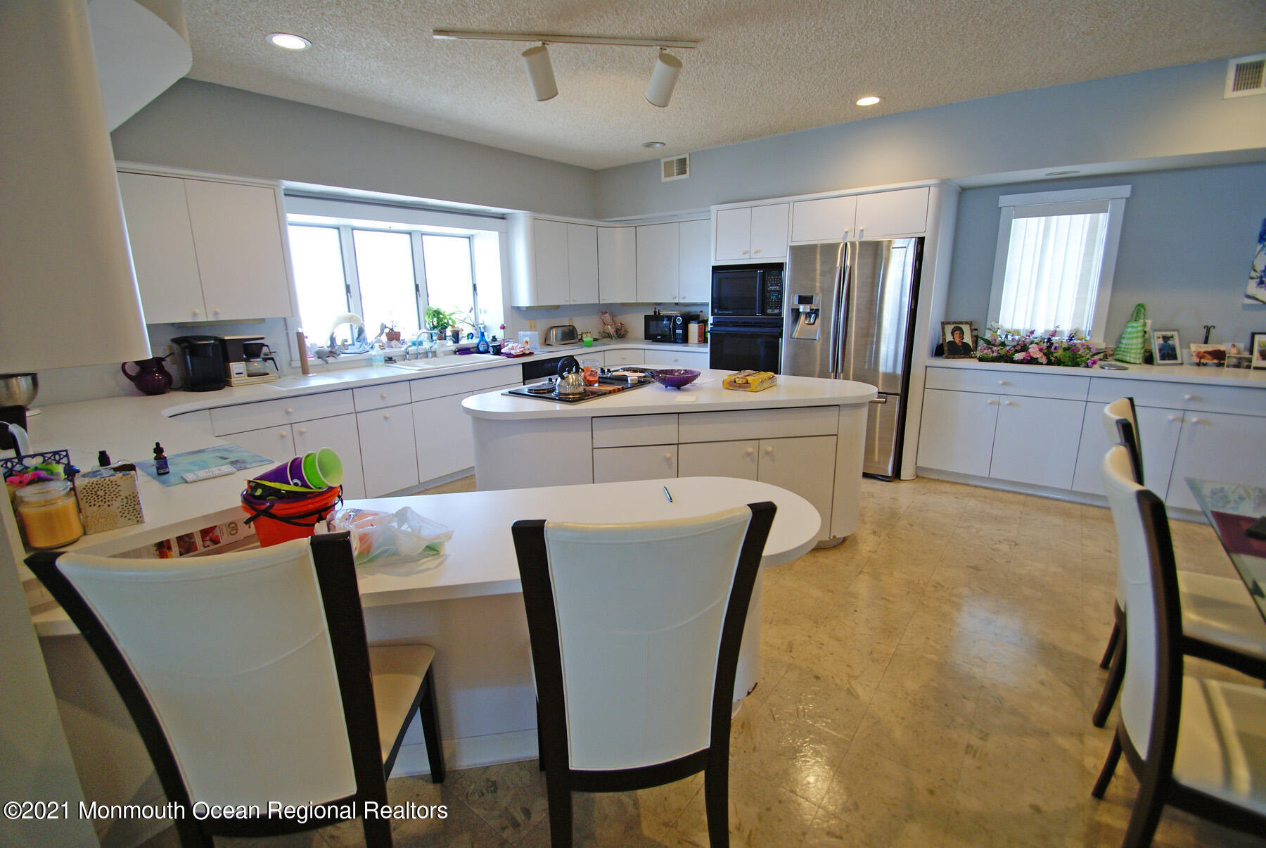 106 Oceanfront Lavallette, NJ 08735 - Photo 11 of 20 a living room with stainless steel appliances furniture a dining table and kitchen view