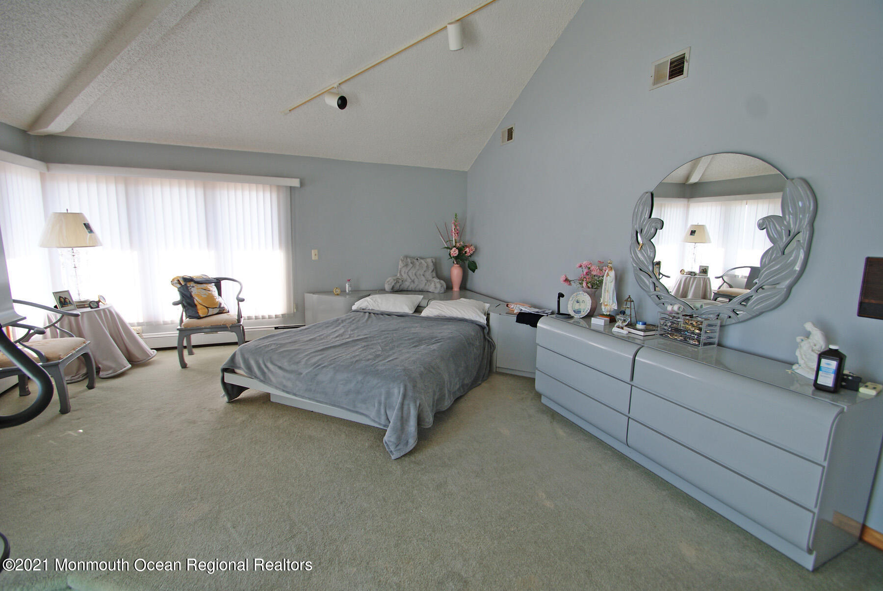 106 Oceanfront Lavallette, NJ 08735 - Photo 12 of 20 a spacious bedroom with a bed mirror and window