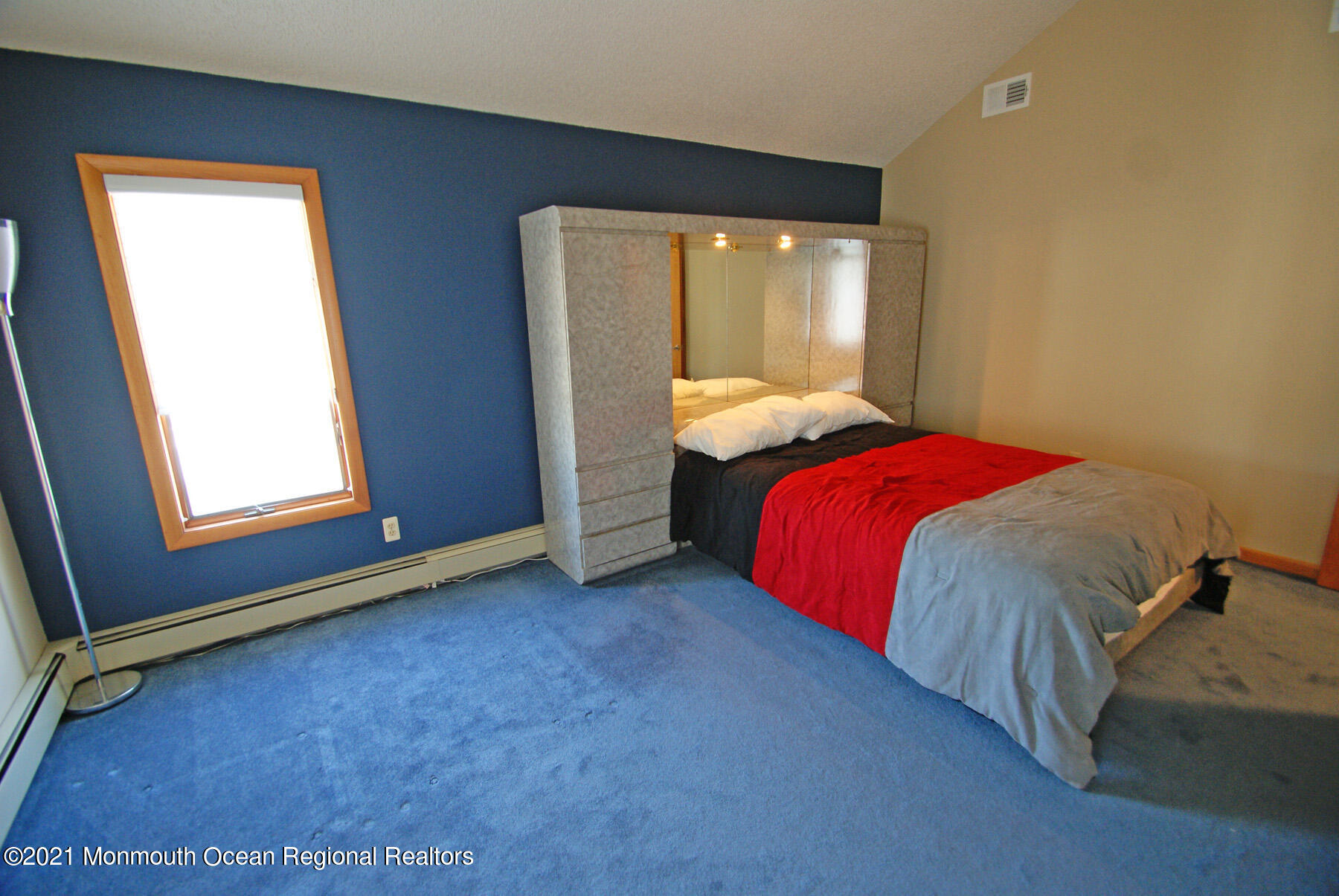 106 Oceanfront Lavallette, NJ 08735 - Photo 19 of 20 a bed sitting in a room next to a window