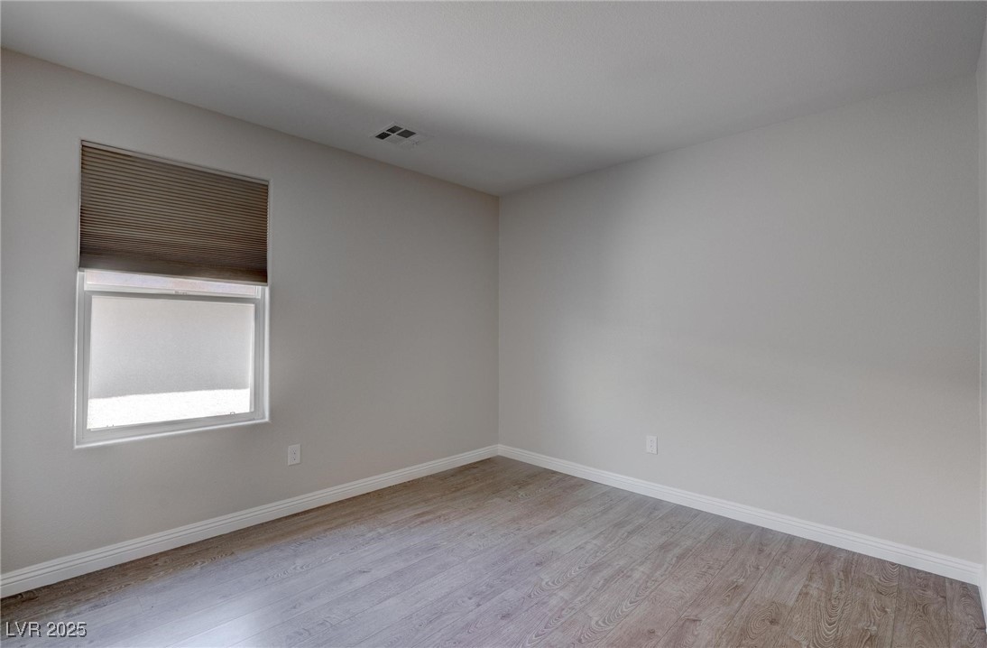 10273 Aragon Crown Road Las Vegas, NV 89135 - Photo 16 of 45 Spare room featuring light wood-type flooring
