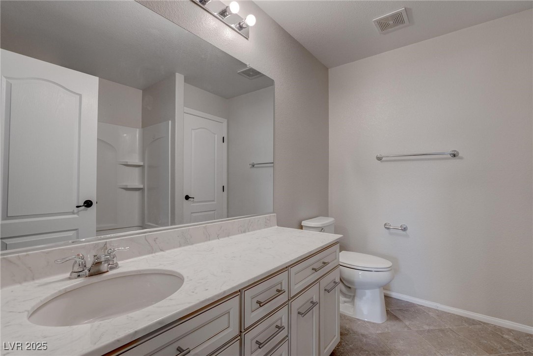 10273 Aragon Crown Road Las Vegas, NV 89135 - Photo 20 of 45 Bathroom with vanity and a shower