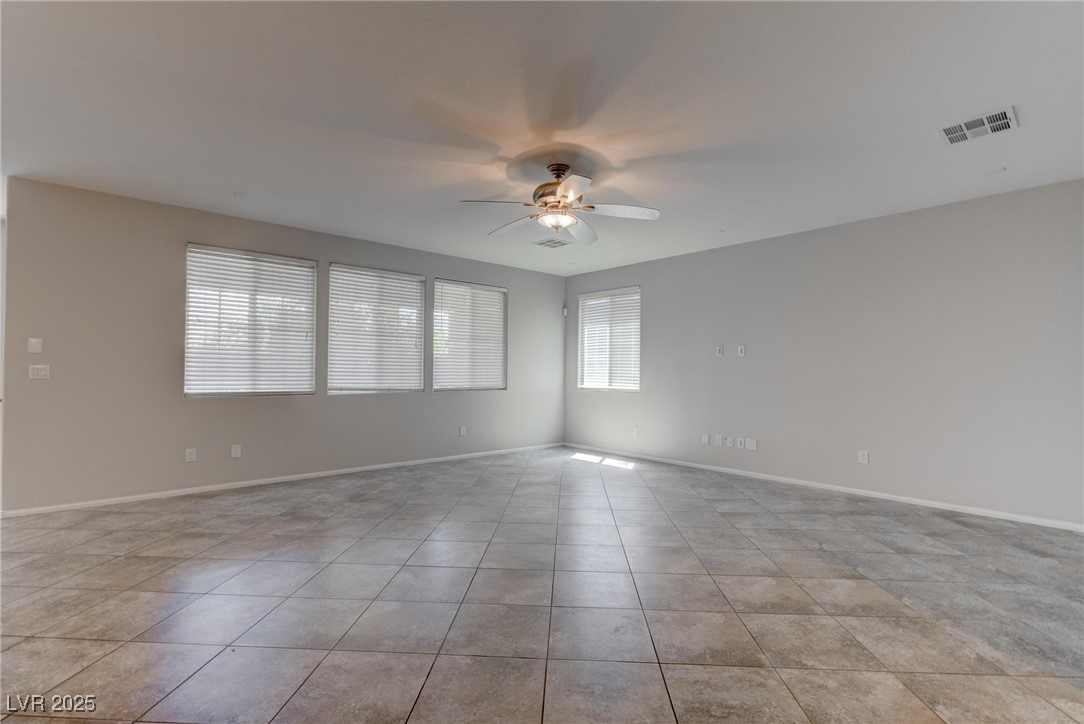10273 Aragon Crown Road Las Vegas, NV 89135 - Photo 25 of 45 Spare room featuring a ceiling fan and light tile patterned flooring