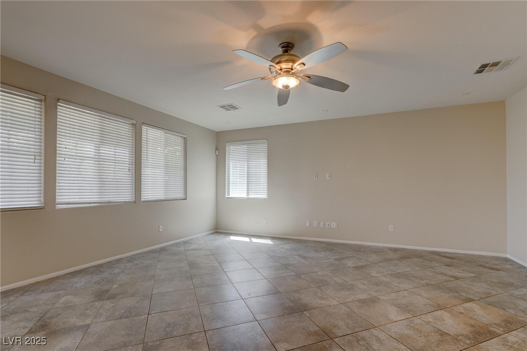 10273 Aragon Crown Road Las Vegas, NV 89135 - Photo 3 of 45 Unfurnished room featuring ceiling fan and light tile patterned flooring