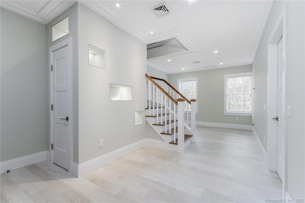 1990 Bronson Road, Unit 8 Fairfield, CT 06824 - Photo 11 of 28 en view interior of a house with stairs