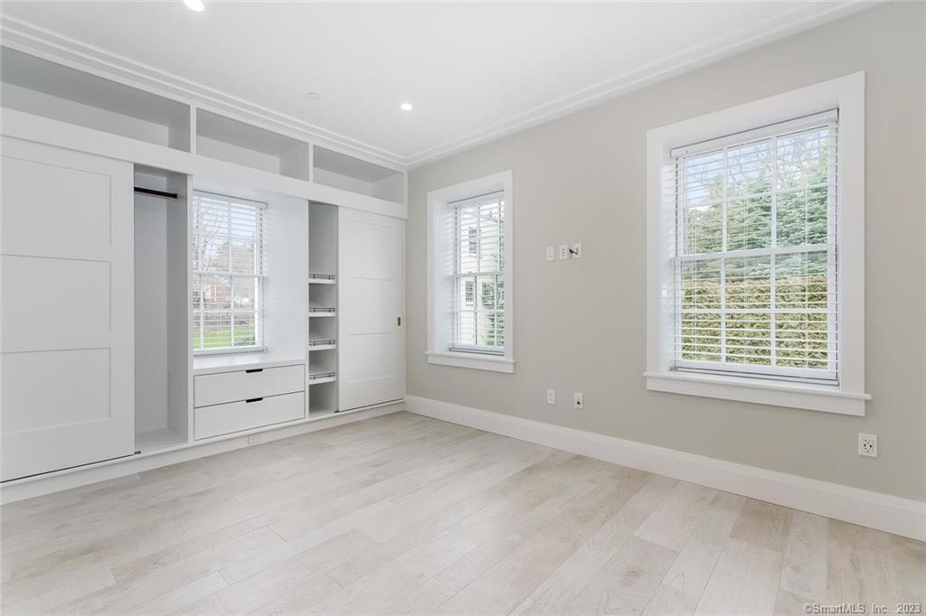 1990 Bronson Road, Unit 8 Fairfield, CT 06824 - Photo 13 of 28 a view of an empty room with a window
