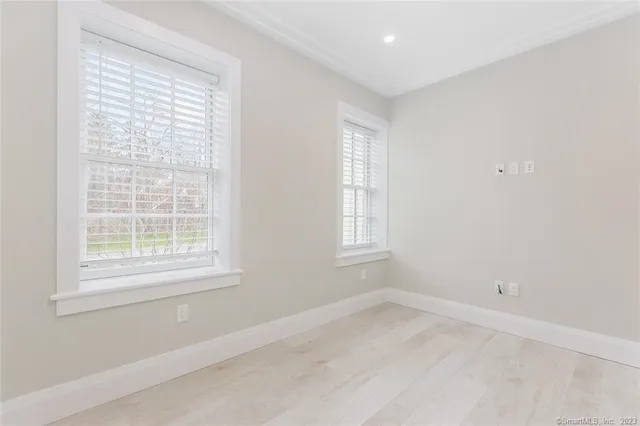 a bathroom with a sink toilet and a mirror