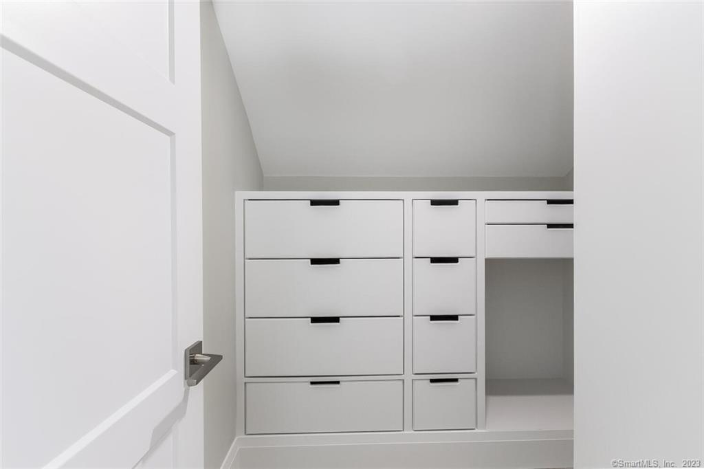 1990 Bronson Road, Unit 8 Fairfield, CT 06824 - Photo 18 of 28 a view of an empty walk in closet