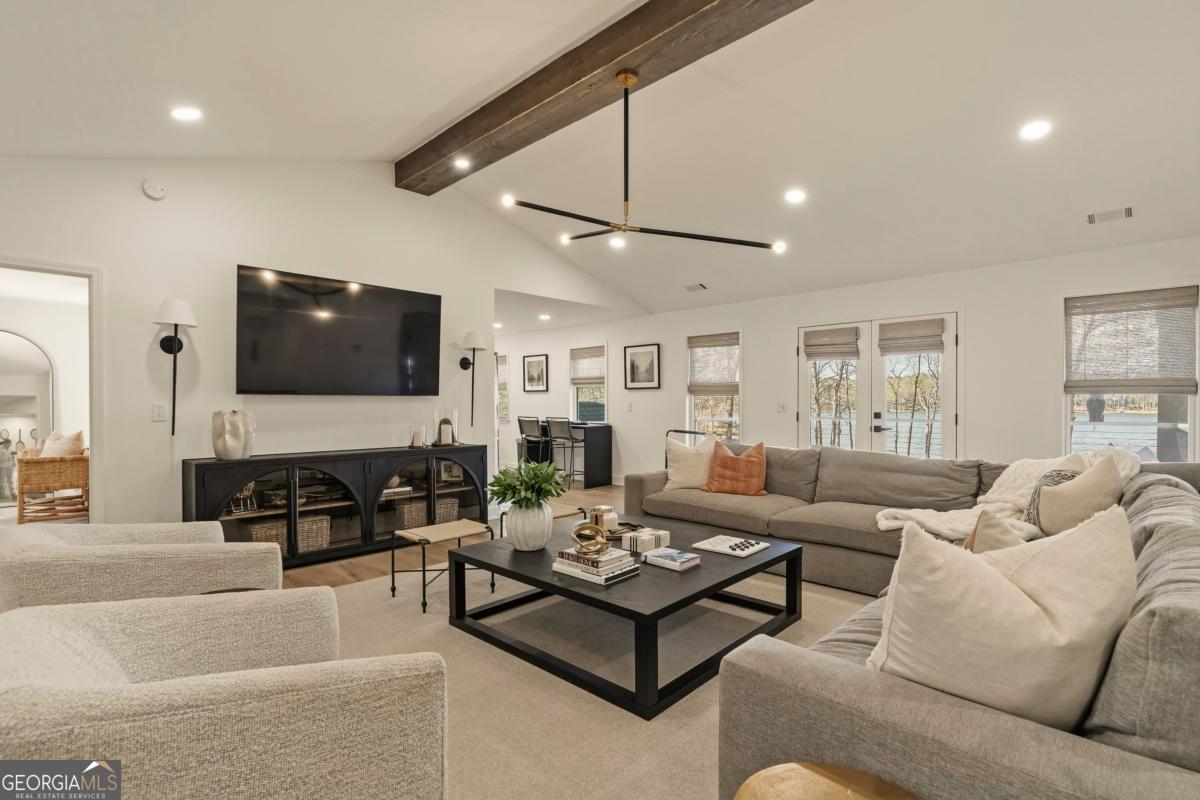 121 Mags Path Eatonton, GA 31024 - Photo 12 of 74 a living room with furniture and a flat screen tv