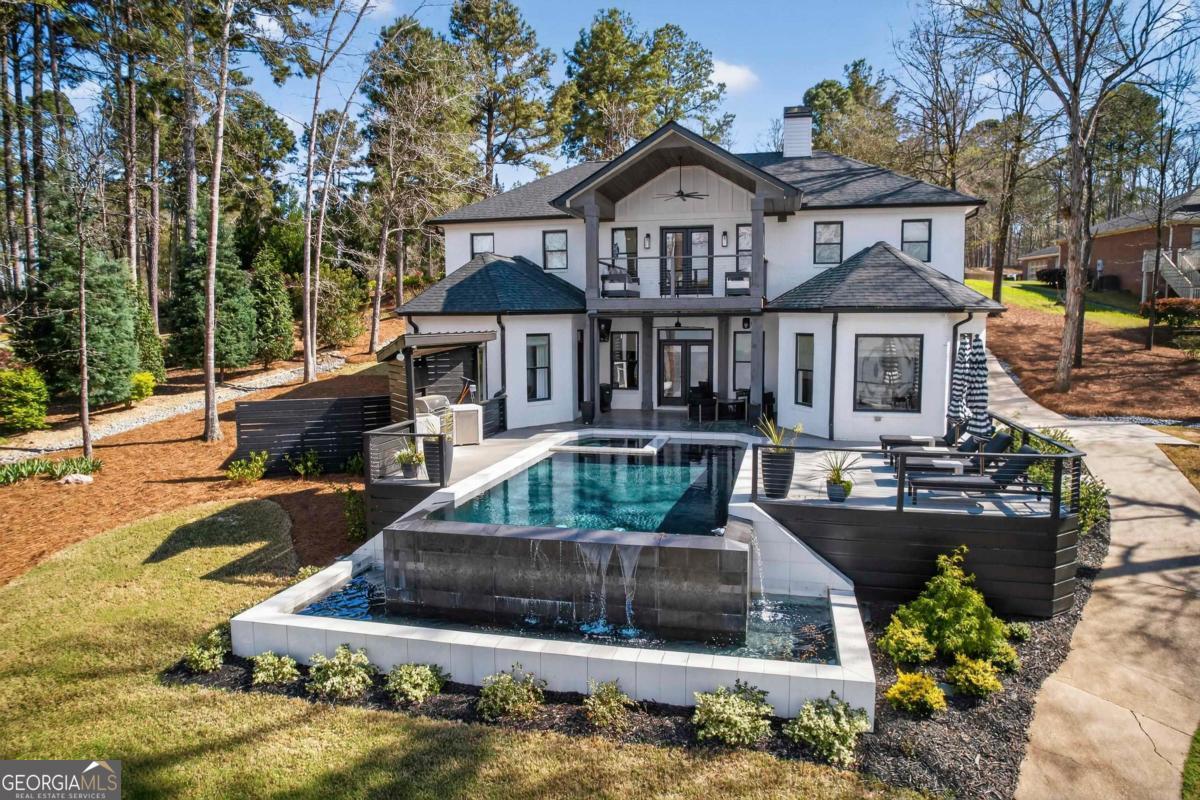 121 Mags Path Eatonton, GA 31024 - Photo 2 of 74 a front view of a house with swimming pool