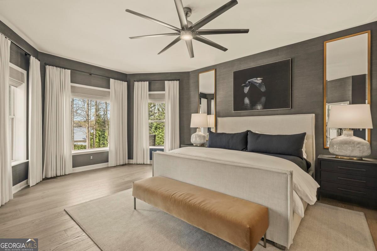 121 Mags Path Eatonton, GA 31024 - Photo 23 of 74 a spacious bedroom with a large bed and a large window