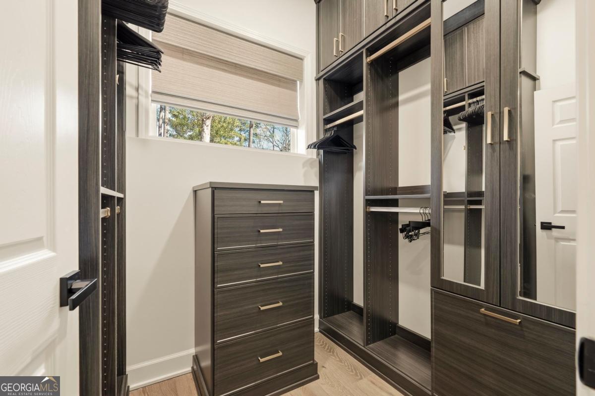 121 Mags Path Eatonton, GA 31024 - Photo 27 of 74 a view of walk in closet with clothes and shoes