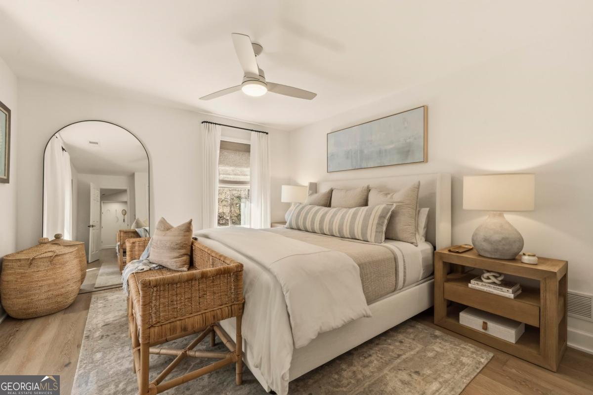 121 Mags Path Eatonton, GA 31024 - Photo 33 of 74 a bedroom with a bed and wooden floor