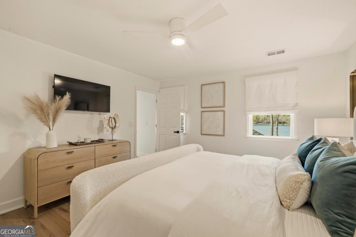 121 Mags Path Eatonton, GA 31024 - Photo 36 of 74 a bedroom with a bed and a flat screen tv