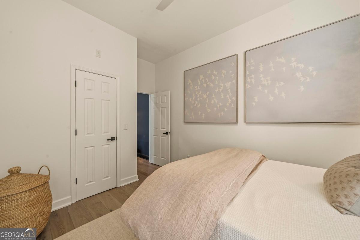 121 Mags Path Eatonton, GA 31024 - Photo 52 of 74 a bedroom with a bed and a painting on the wall