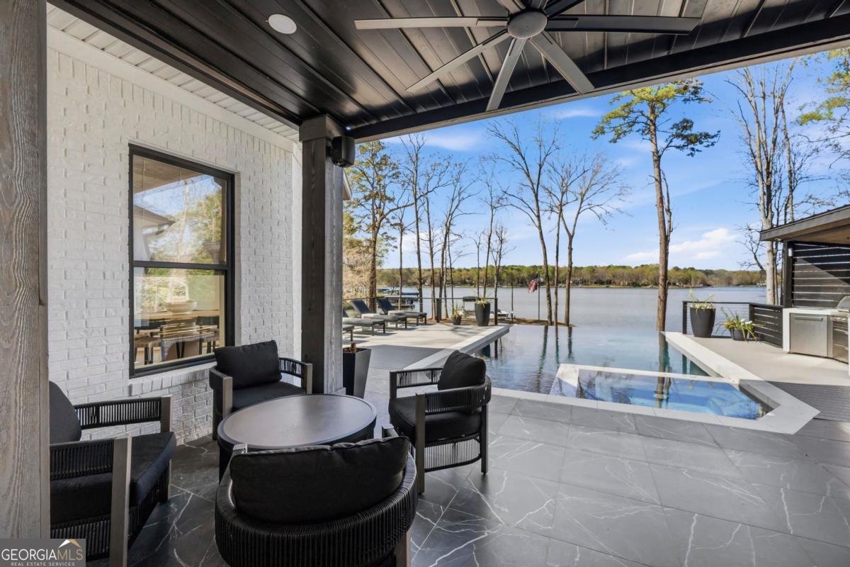 121 Mags Path Eatonton, GA 31024 - Photo 58 of 74 a dining room with furniture and a floor to ceiling window
