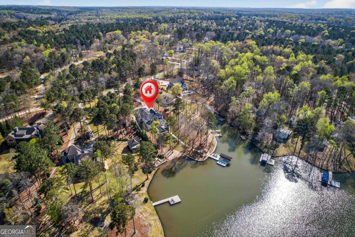 121 Mags Path Eatonton, GA 31024 - Photo 64 of 74 an aerial view of a house with a yard and lake view