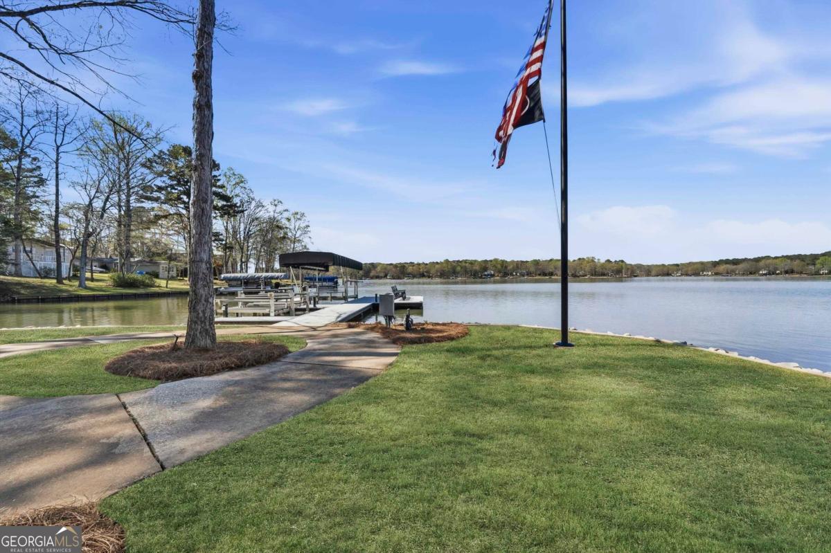 121 Mags Path Eatonton, GA 31024 - Photo 70 of 74 a view of a lake with a palm tree next to lake