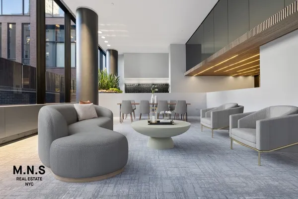 a living room with furniture and a potted plant