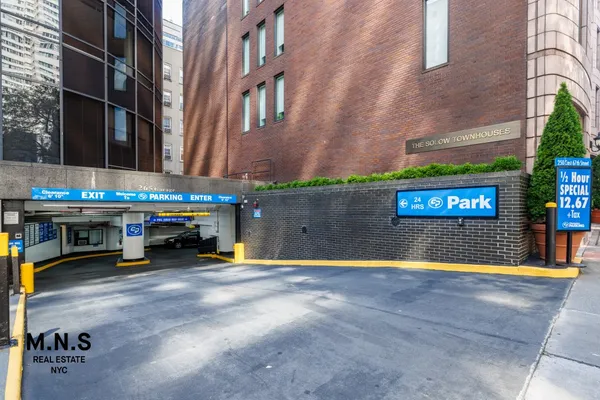an outdoor space with pool and furniture