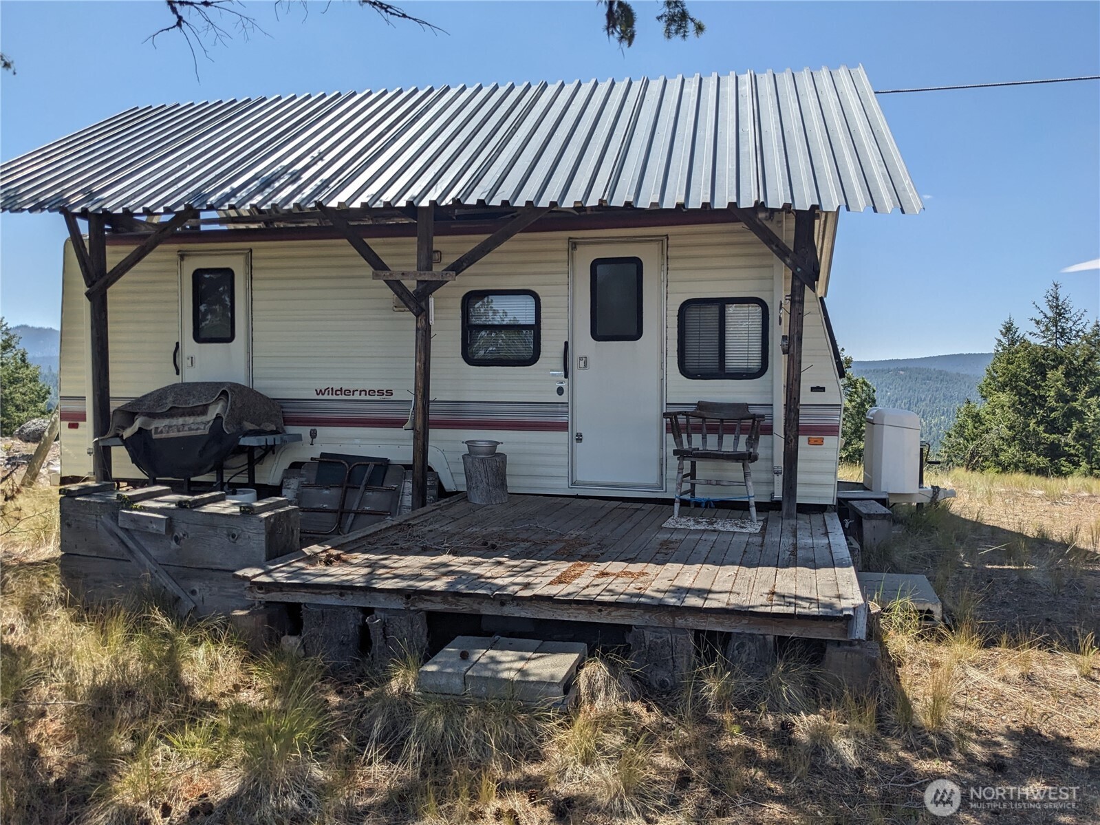 0 Mule Deer Road Republic, WA 99166 - Photo 18 of 23 a front view of a house with a boat