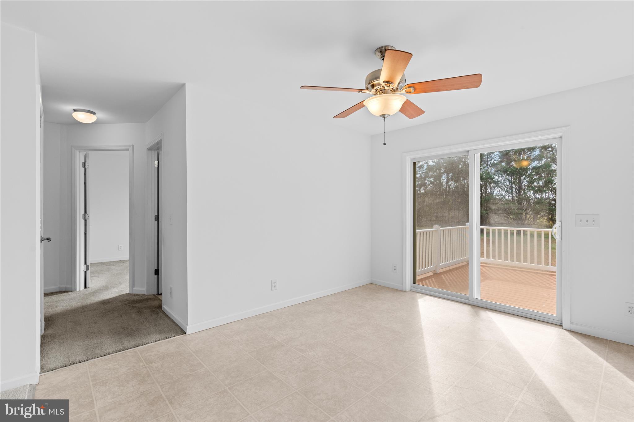 12454 Mirey Branch Road Laurel, DE 19956 - Photo 12 of 51 a view of empty room with wooden floor and fan
