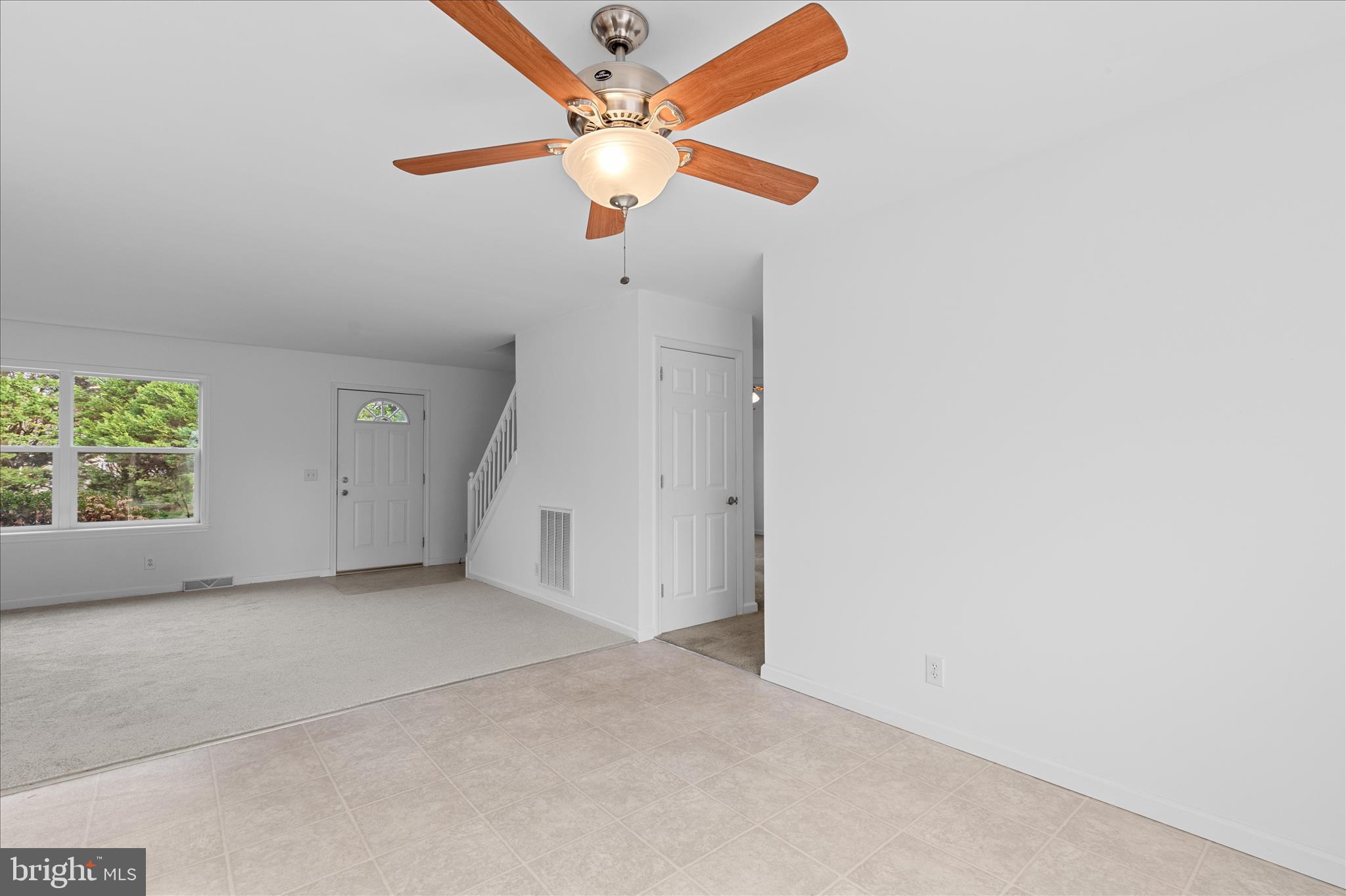 12454 Mirey Branch Road Laurel, DE 19956 - Photo 13 of 51 an empty room with a window and a ceiling fan