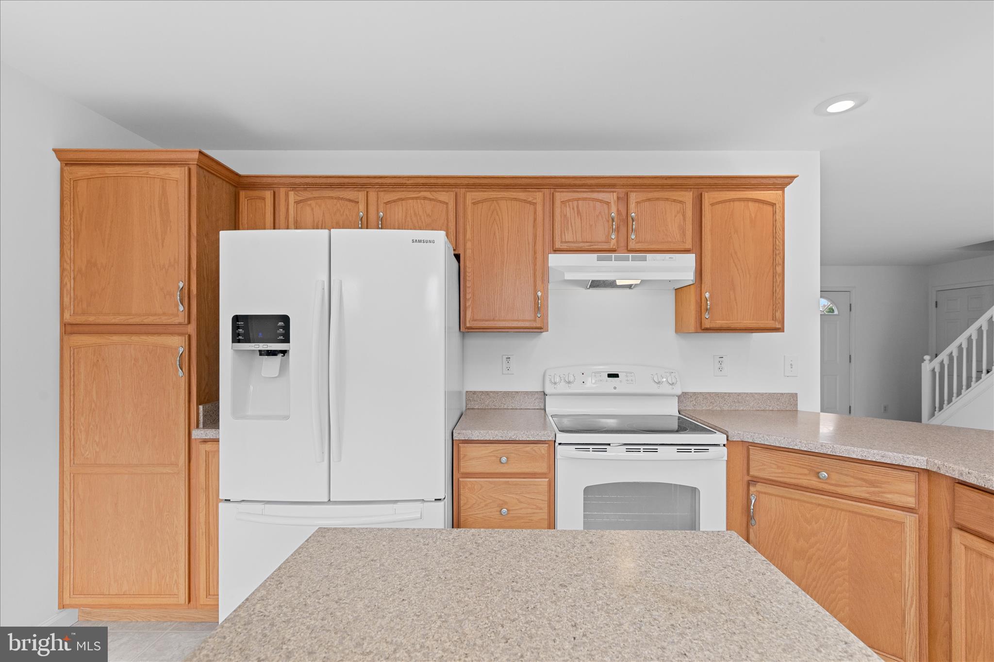 12454 Mirey Branch Road Laurel, DE 19956 - Photo 19 of 51 a kitchen with a refrigerator sink and cabinets
