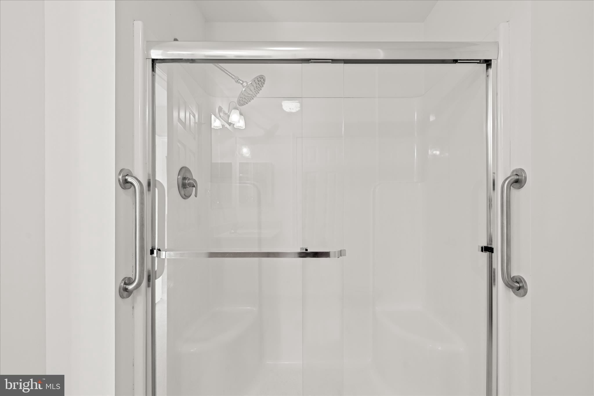 12454 Mirey Branch Road Laurel, DE 19956 - Photo 25 of 51 a bathroom with a glass shower door