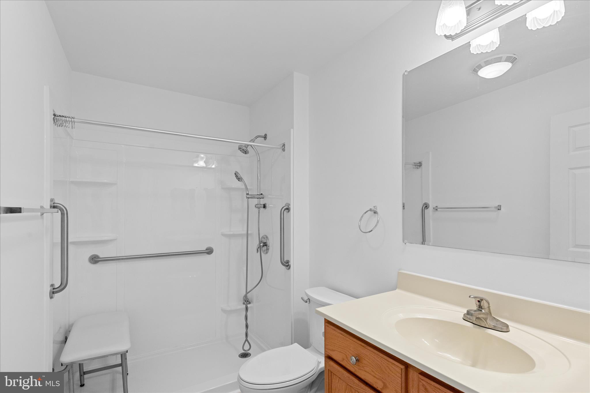 12454 Mirey Branch Road Laurel, DE 19956 - Photo 28 of 51 a bathroom with a sink toilet and shower