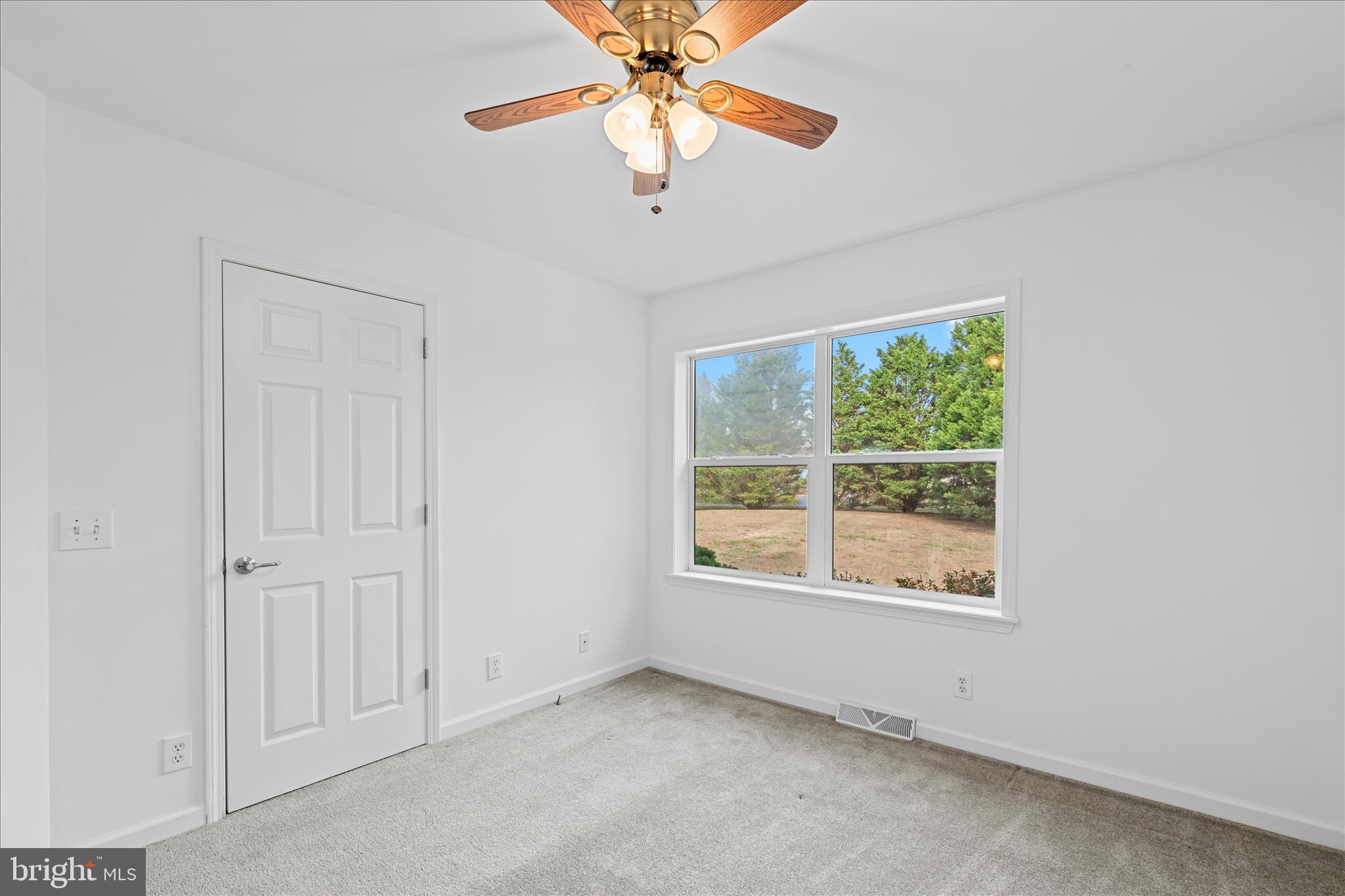 12454 Mirey Branch Road Laurel, DE 19956 - Photo 34 of 51 an empty room with a window and a fan