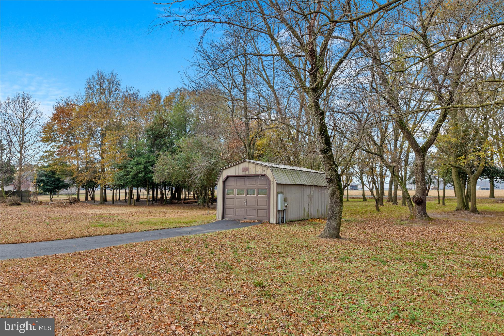 12454 Mirey Branch Road Laurel, DE 19956 - Photo 50 of 51 a front view of a house with a yard and garage