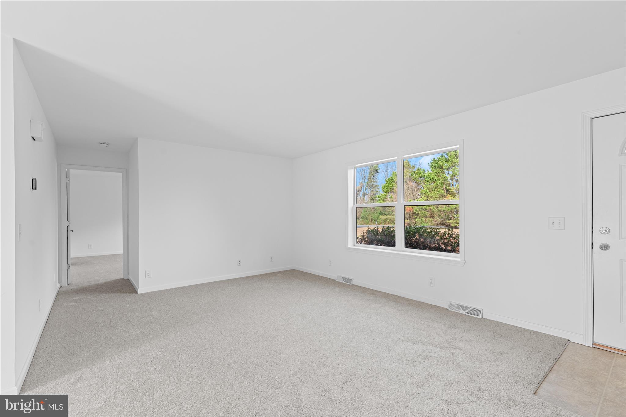 12454 Mirey Branch Road Laurel, DE 19956 - Photo 9 of 51 an empty room with a window