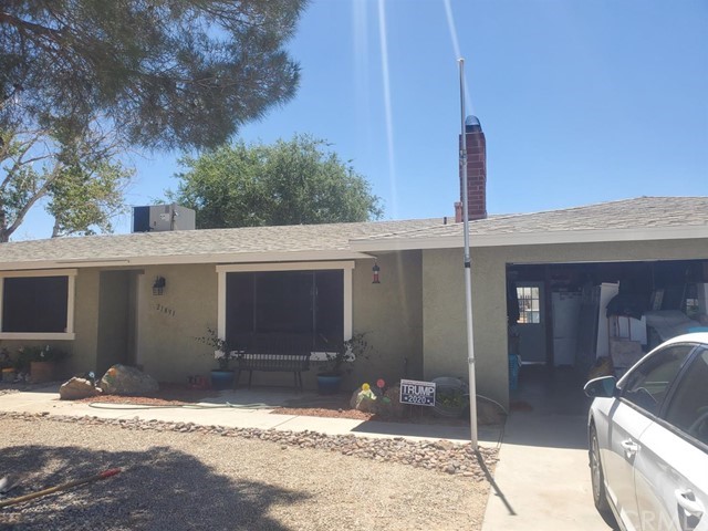 21891 Otoe Road Apple Valley, CA 92307 - Photo 1 of 1 a front view of a house