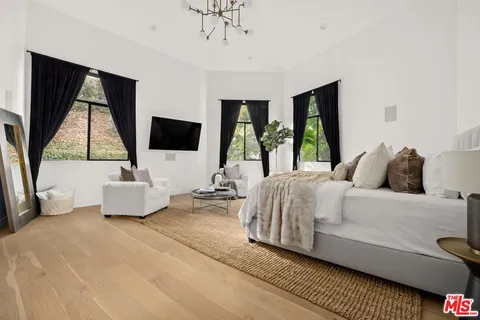 a living room with a couch and a flat screen tv