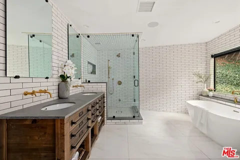 a kitchen with a sink stove and shower