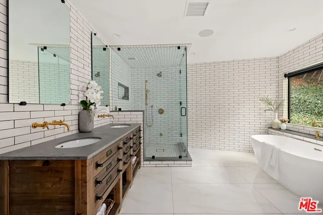 a kitchen with a sink stove and shower