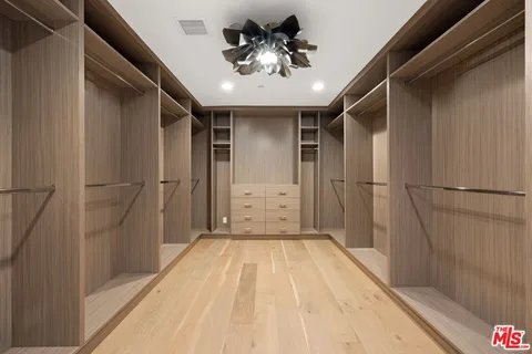 a view of a hallway with a chandelier