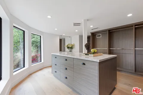 a kitchen with a stove and a refrigerator
