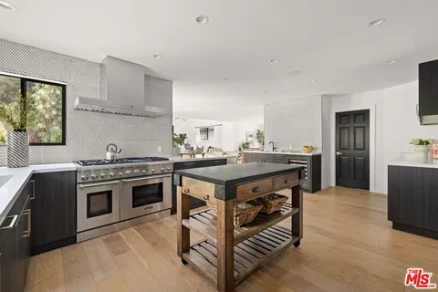 a kitchen with a stove and a sink