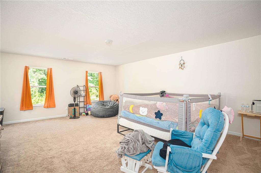 635 Meadows Farm Way Monroe, GA 30655 - Photo 20 of 36 a living room with furniture and a window