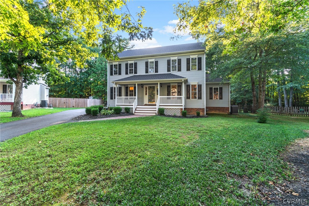 3704 Pease Road Midlothian, VA 23112 - Photo 1 of 50 a front view of a house with a yard and trees