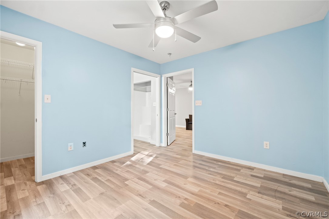 3704 Pease Road Midlothian, VA 23112 - Photo 17 of 50 a view of a room with wooden floor and a ceiling fan