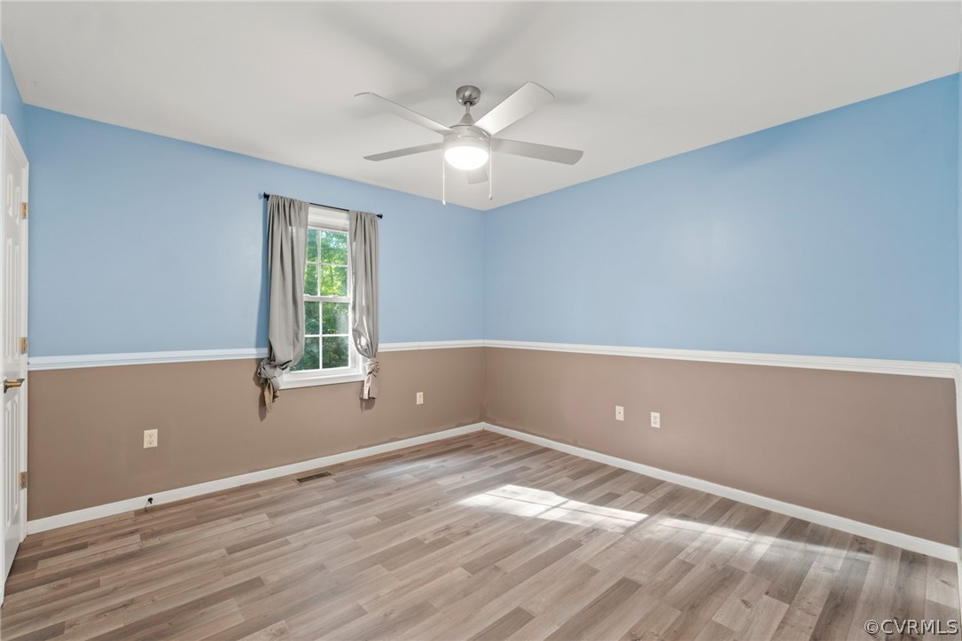 3704 Pease Road Midlothian, VA 23112 - Photo 20 of 50 an empty room with wooden floor and windows