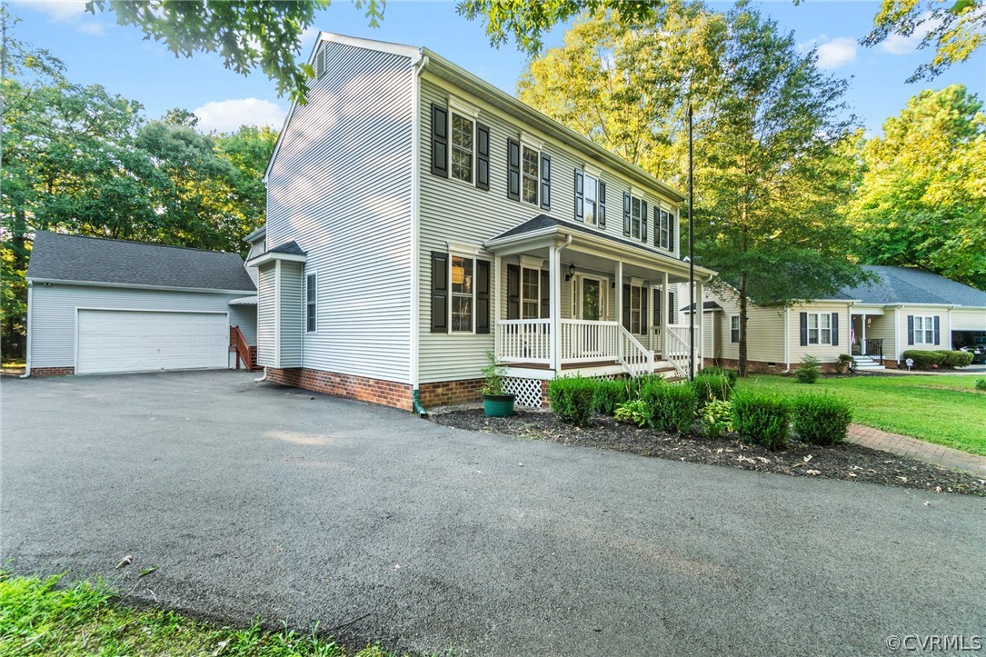 3704 Pease Road Midlothian, VA 23112 - Photo 2 of 50 a view of a house with a garden and pathway