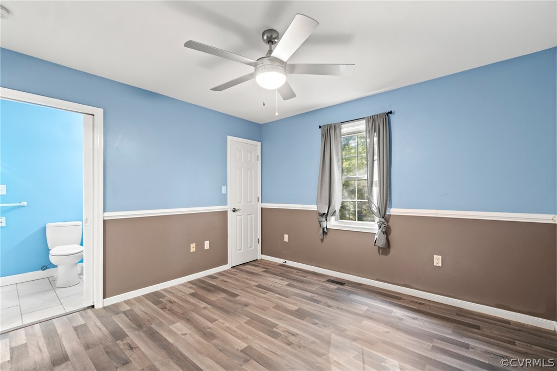 3704 Pease Road Midlothian, VA 23112 - Photo 21 of 50 a view of empty room with wooden floor and fan