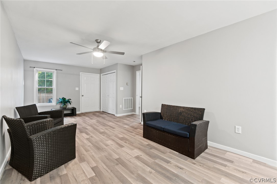 3704 Pease Road Midlothian, VA 23112 - Photo 28 of 50 a living room with furniture and a ceiling fan