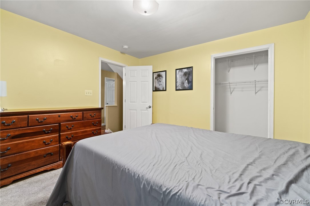 3704 Pease Road Midlothian, VA 23112 - Photo 30 of 50 a bedroom with a bed and wooden floor