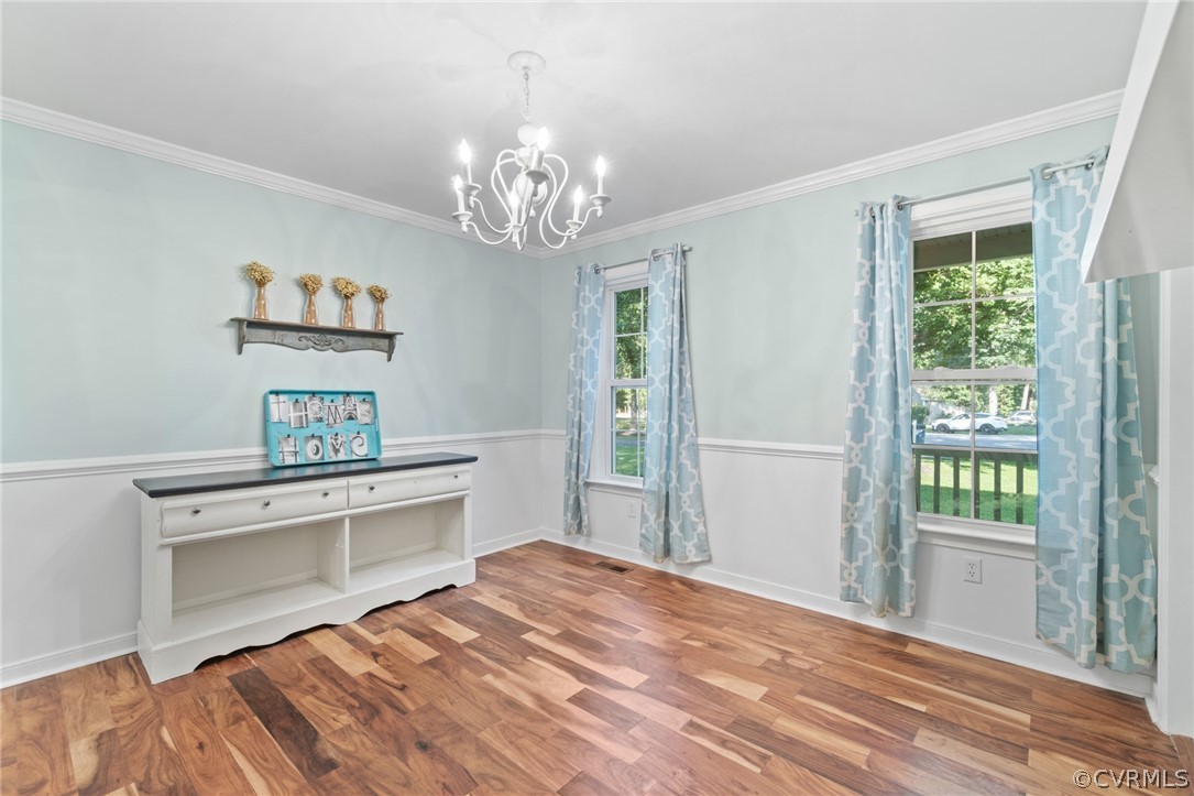 3704 Pease Road Midlothian, VA 23112 - Photo 3 of 50 a bedroom with a bed and a chandelier